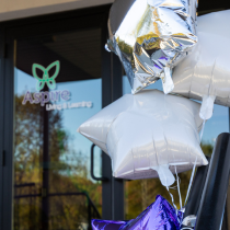 Glass door with the Aspire Living & Learning logo