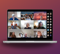 A laptop with nine coworkers in a virtual meeting.