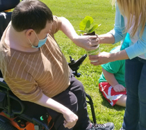 James planting a flower