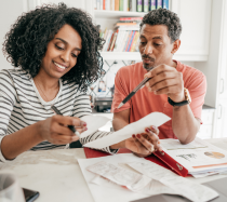 Woman and man looking at paperwork.