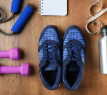 Workout equipment including blue sneakers and purple weights.